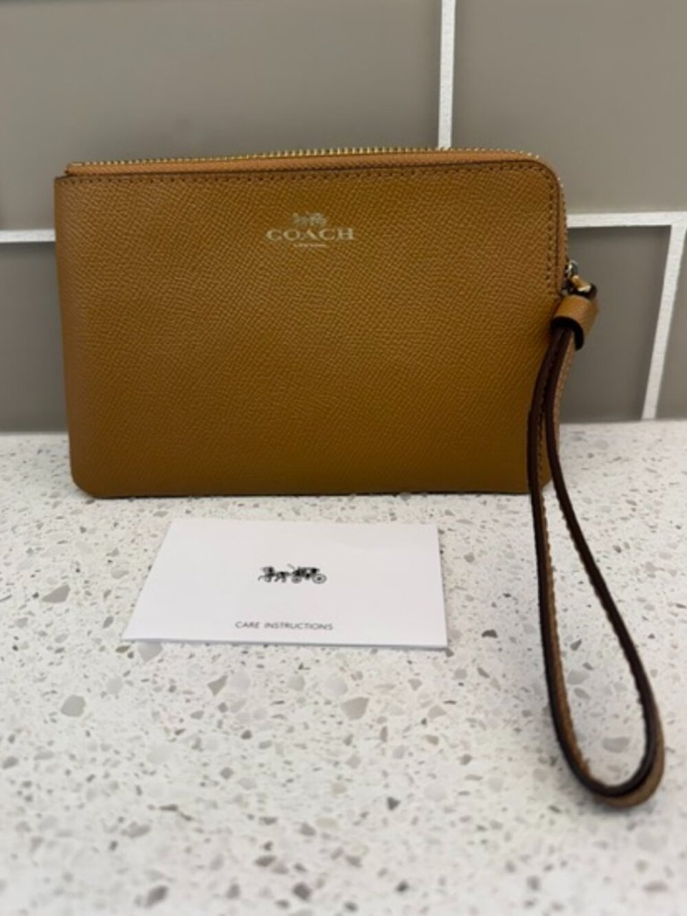 Coach Corner Zip Wristlet in a Textured Honey-Brown Crossgrain Leather